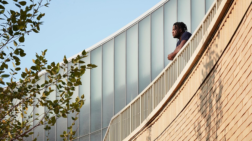 A man looking over the Prairie Shores Clubhouse outdoor staircase.