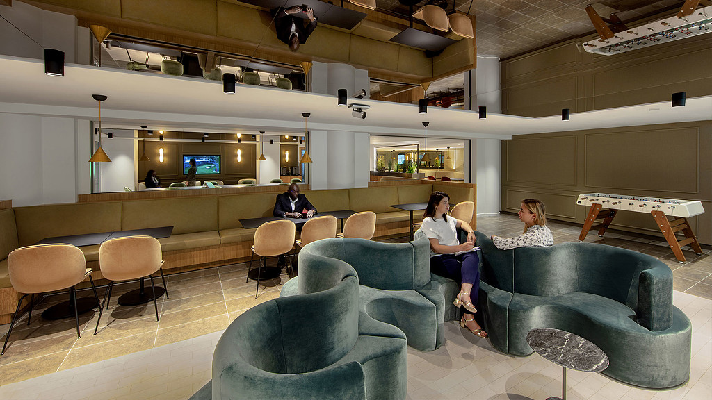 Confidential Paris client office lounge with mirrored ceiling.