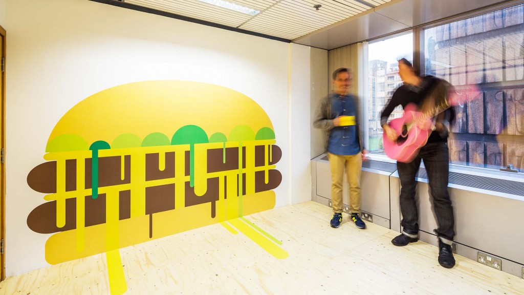 A person standing next to a sign.