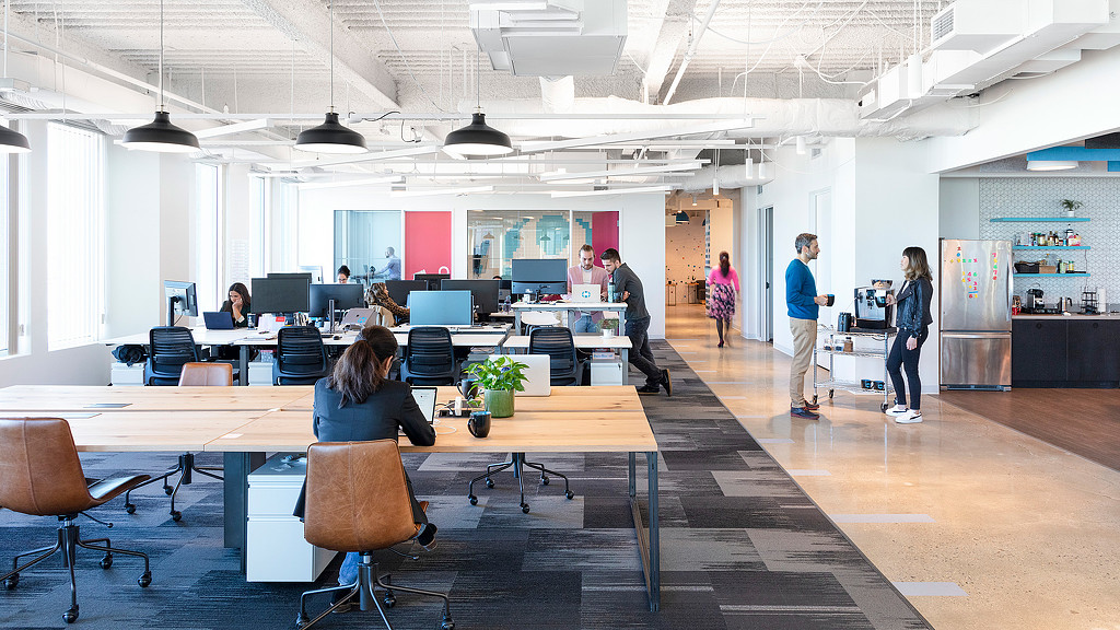 A group of people in an office.