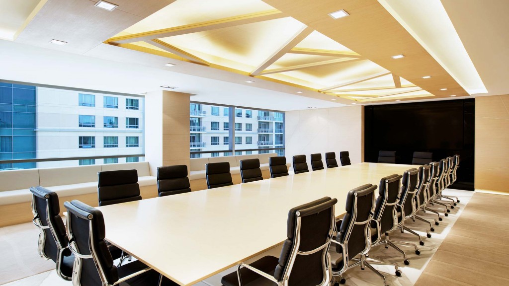 A conference room with a large table.