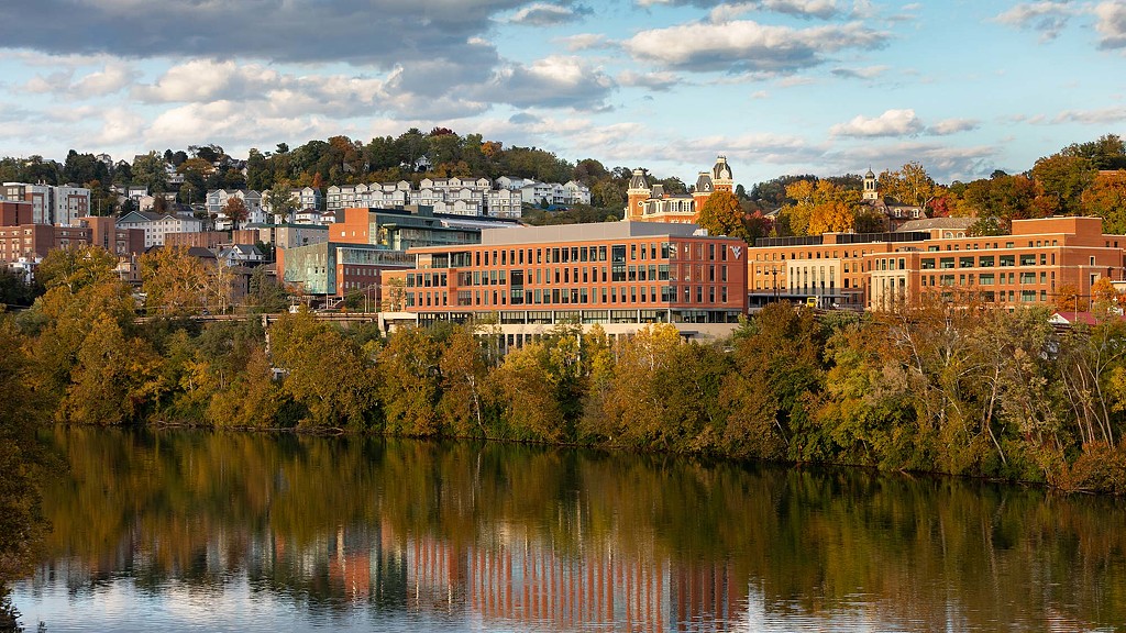 view of WVU Reynolds Hall from across the river