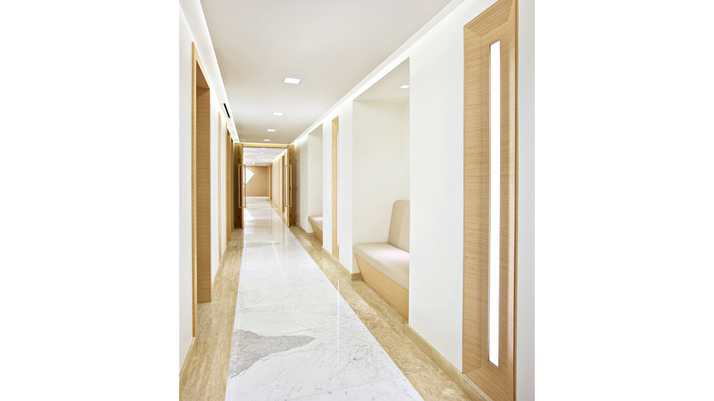 A long hallway with white walls.