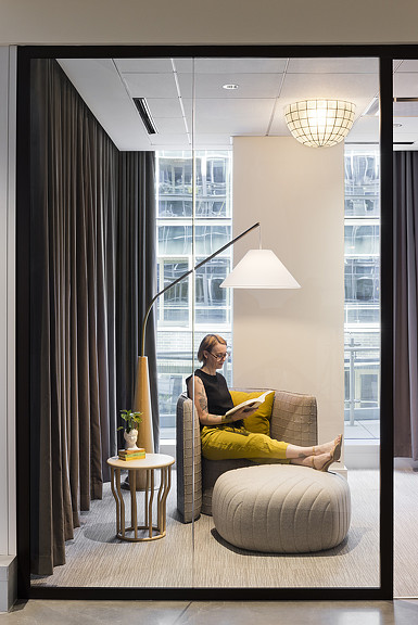 colored furniture pop through minimal interior of esprit's