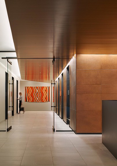 A person standing in a hallway.