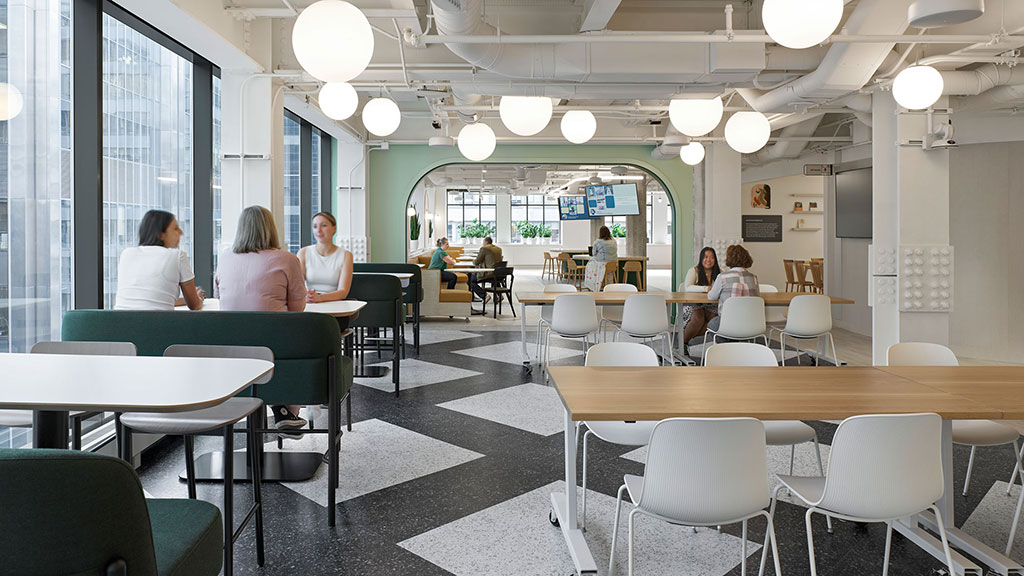 People sitting at tables in a room.
