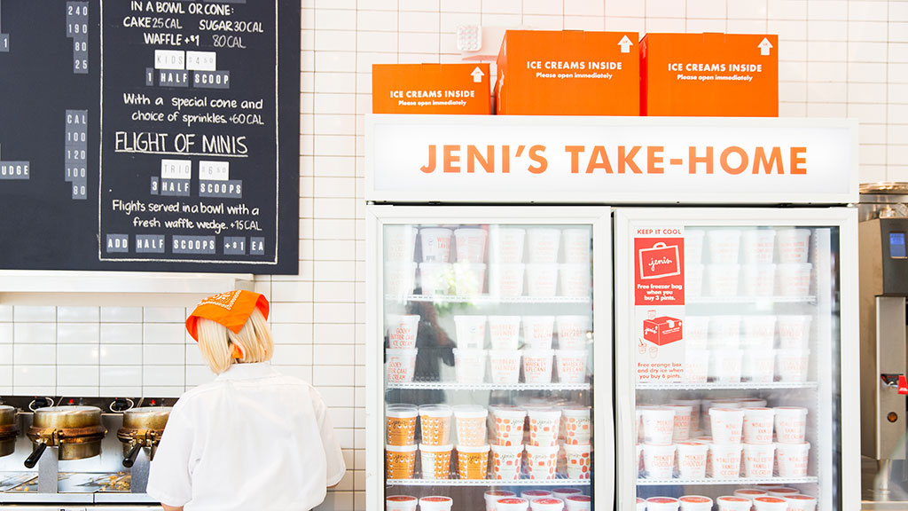 A woman working inside an ice cream store.