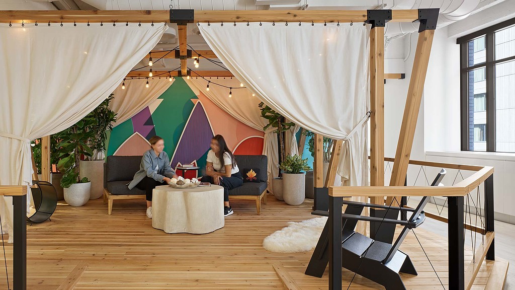 Pinterest semi-enclosed collaboration space themed like a glamping camp site