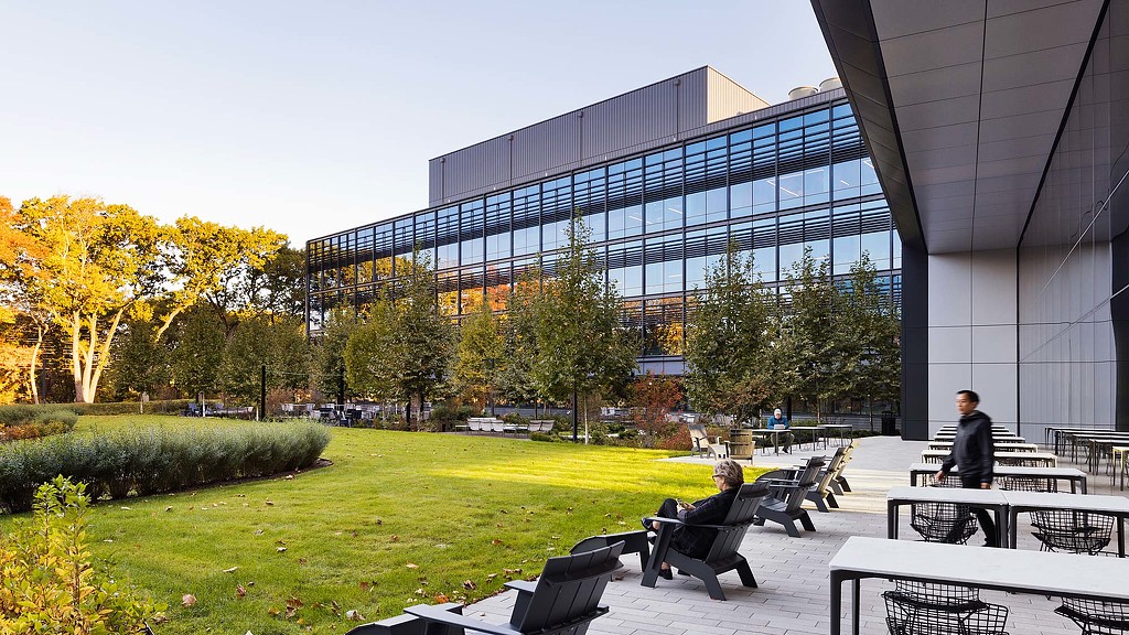 Exterior image of 225 Wyman seating area with lawn and trees