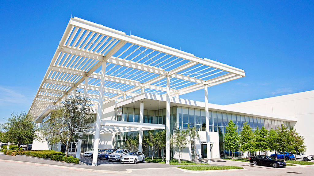 A building with cars parked outside.