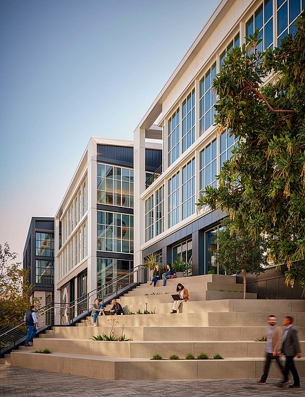 A building with stairs and people outside.