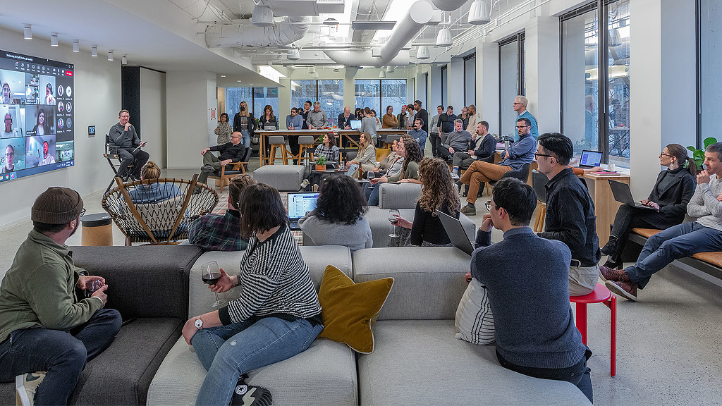 A group of people sitting in a room.