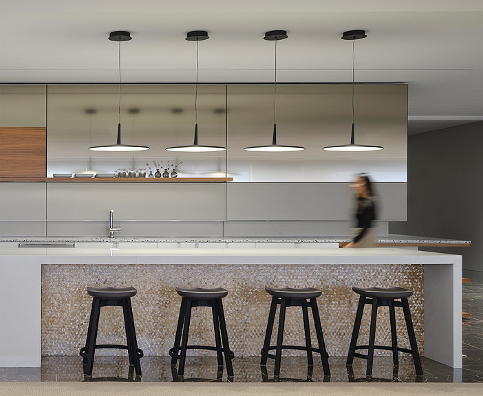 Law firm kitchen space with counter and bar stools