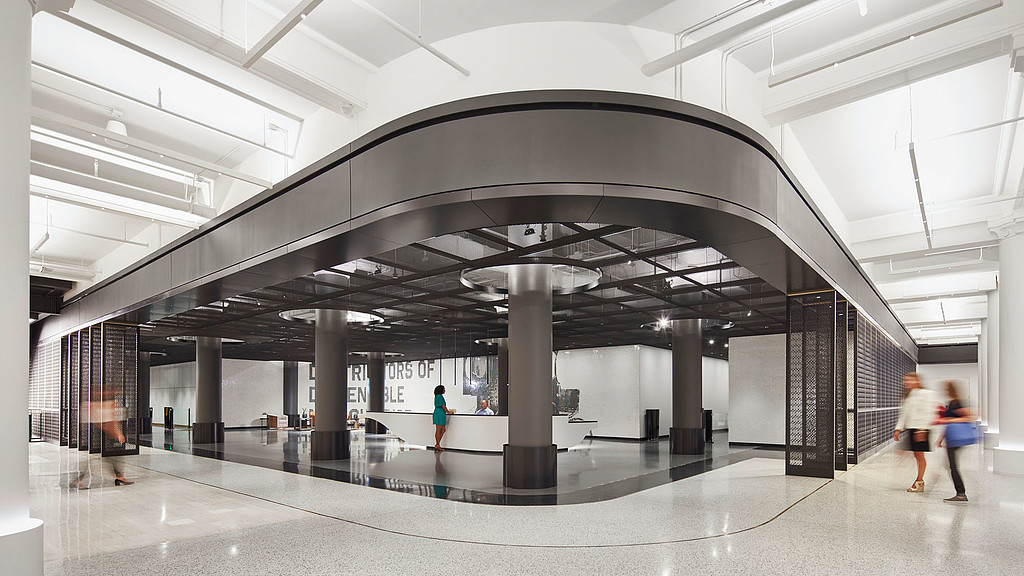 People walking in a large building.