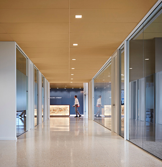 A long hallway with glass doors.