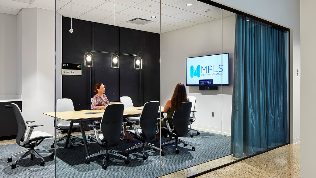 A conference room with glass door at the Minneapolis Chamber of Commerce