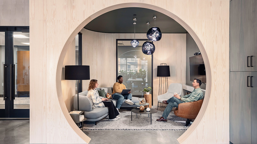 A breakout room for focus conversation and meeting with arch doorway in a modern office