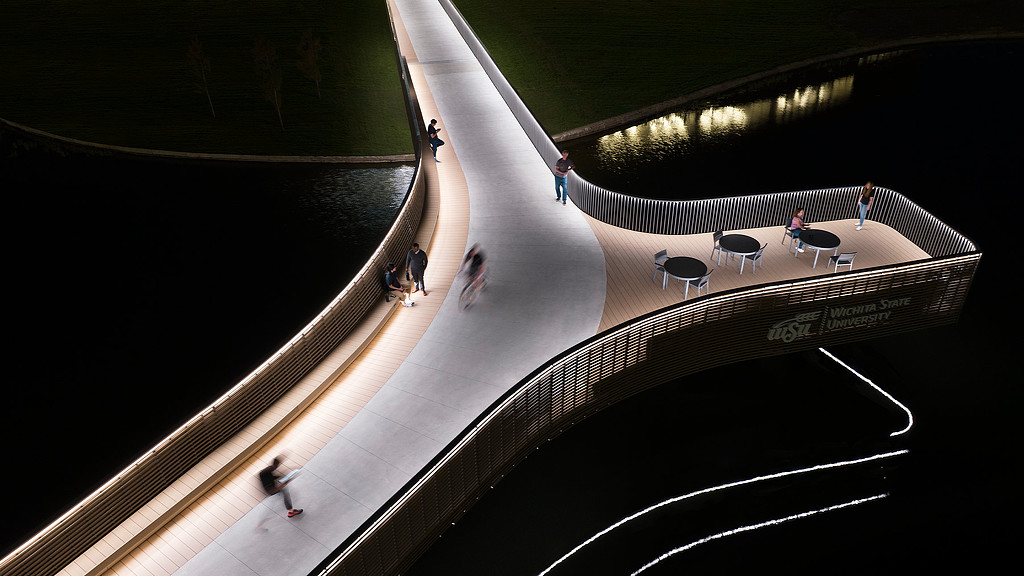People walking on a bridge at Wichita State University Business School in Kansas