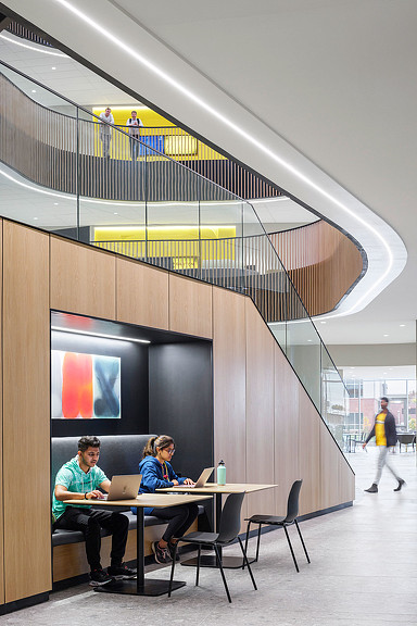 An open stairway at Wichita State University Business School with built in focused seating