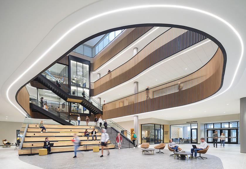 An atrium at Wichita State University Business School in Kansas with a large staircase across multiple levels