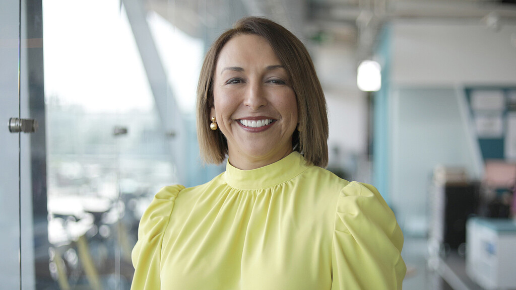 A woman smiling at the camera.