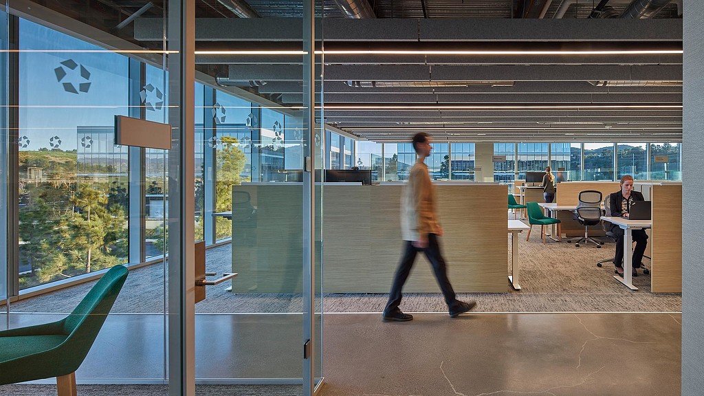 Man walking through CoStar Irvine hallway