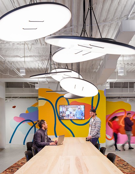 Gusto Denver long table and bright wall graphics