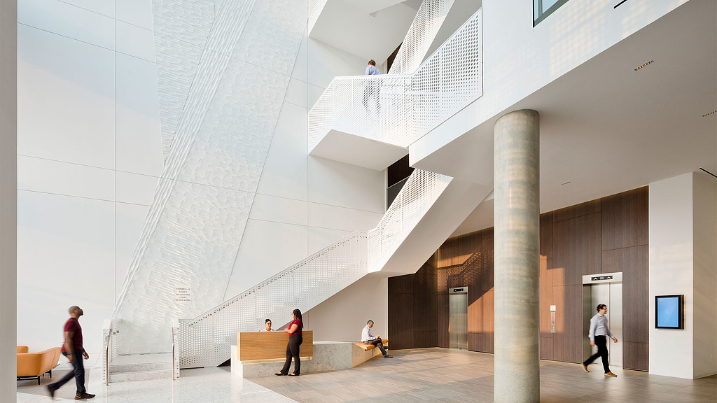 People walking up a staircase.