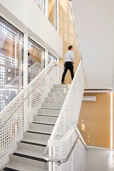A person walking up a staircase.