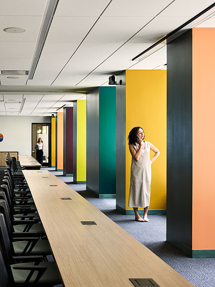A person standing in a hallway.