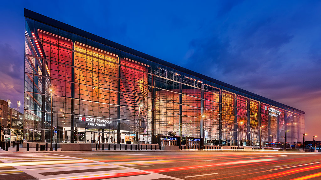 A large building with a large glass wall and a large circular window.