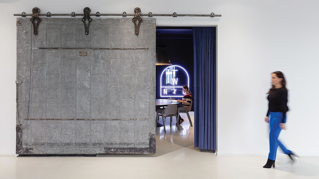 A person walking in a room.