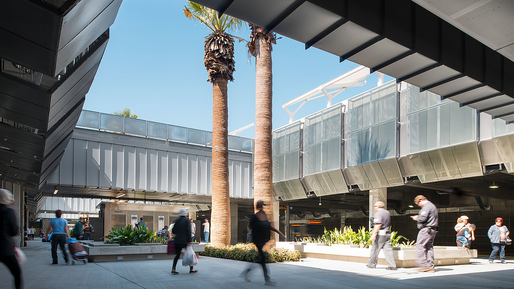 People walking outside a building.
