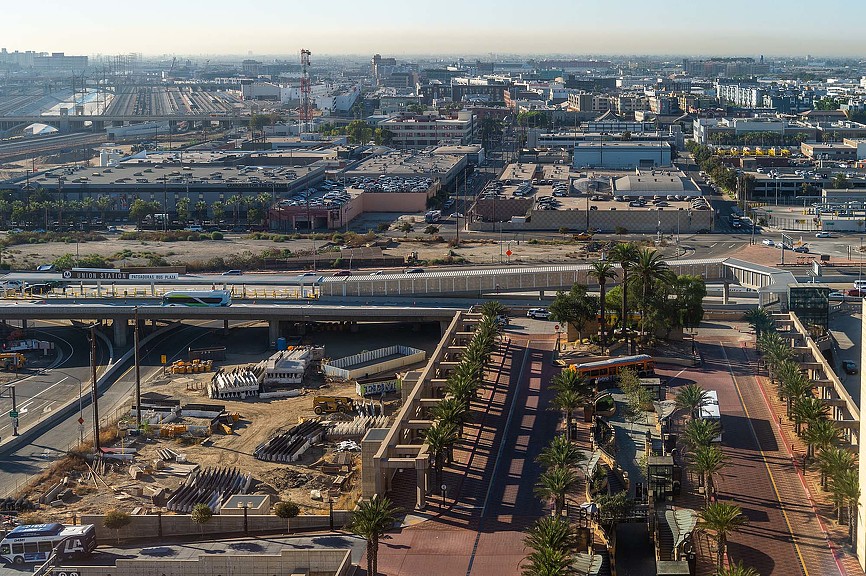 A train station with a train going through it.
