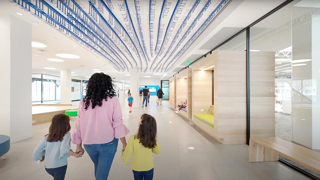 A group of people walking in a building.