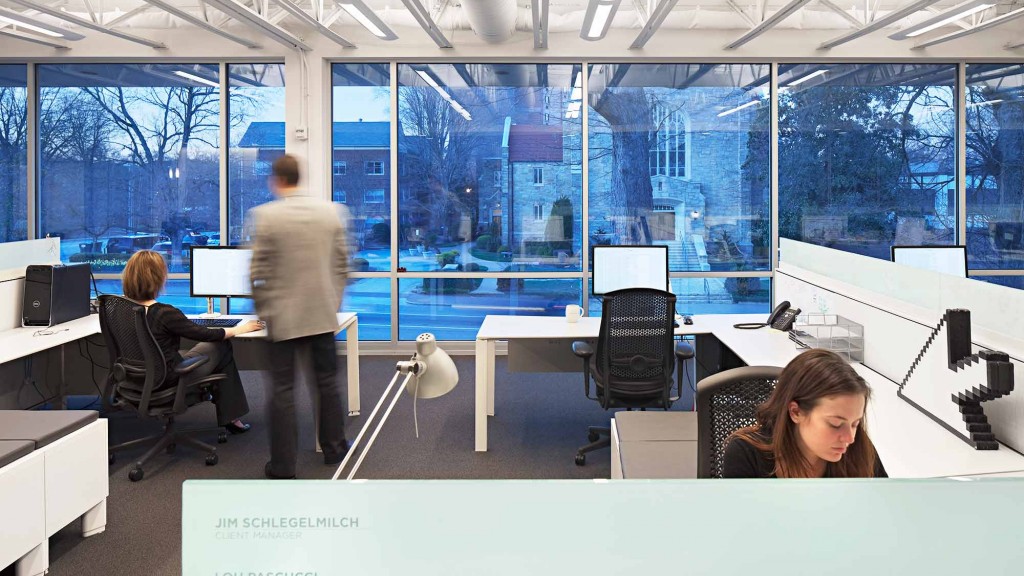 A person sitting at a desk in an office.