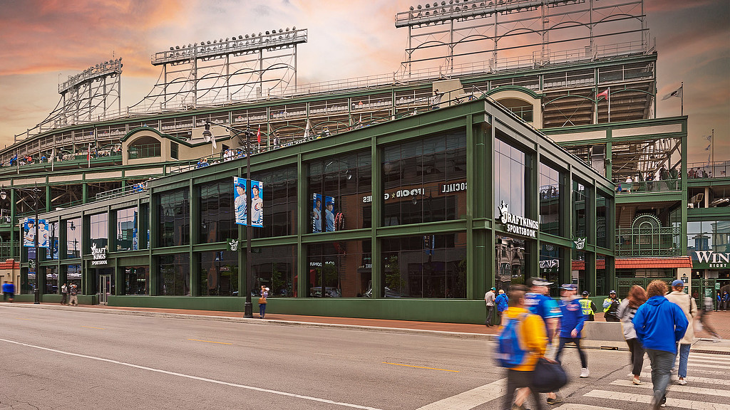 The outside of Draftkings in Wrigley, with large windows and a green structure
