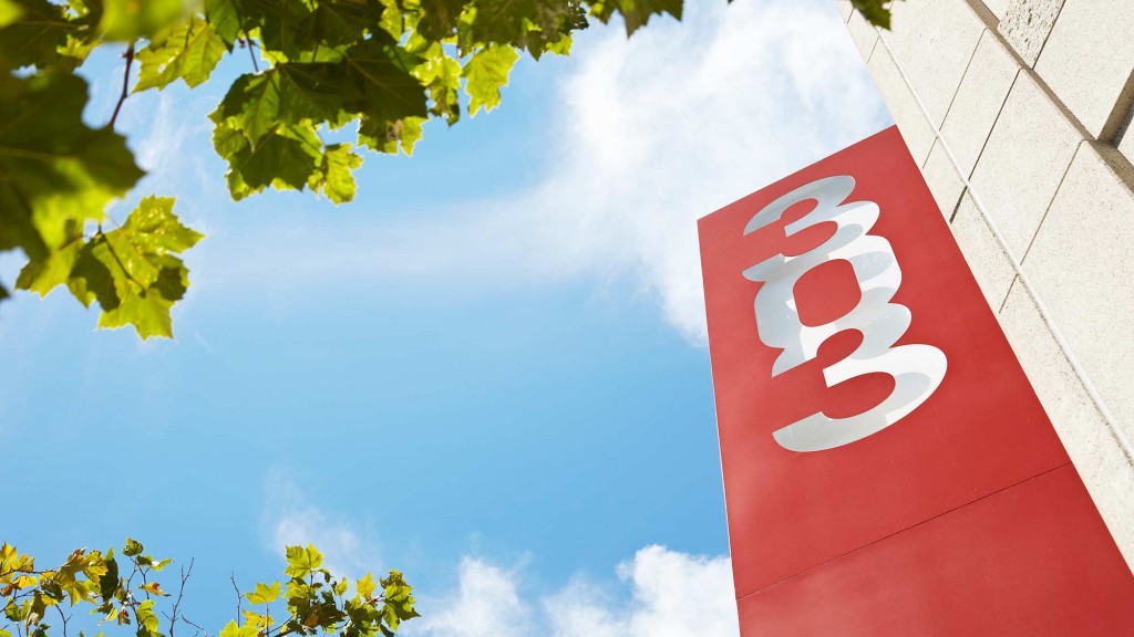 A stop sign with a sticker on it.