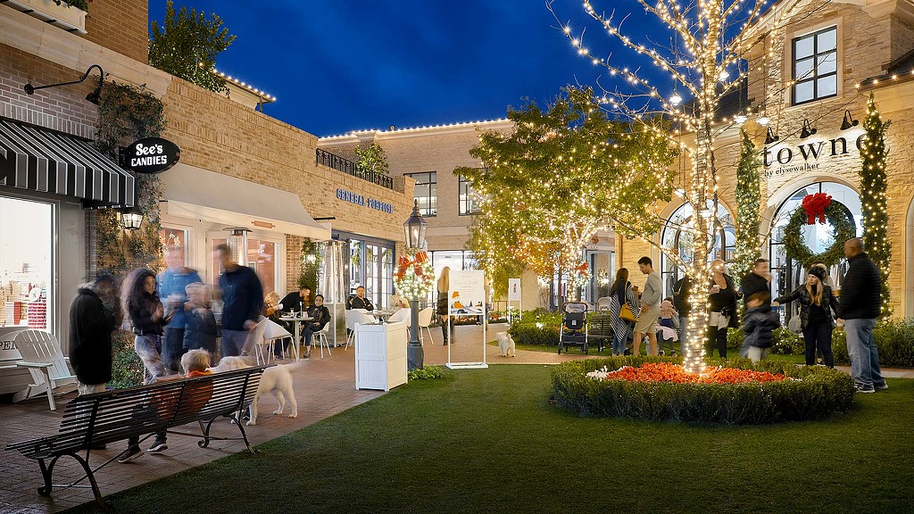 A group of people outside a building.