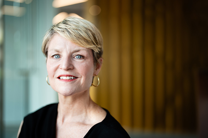 A person with short blonde hair.