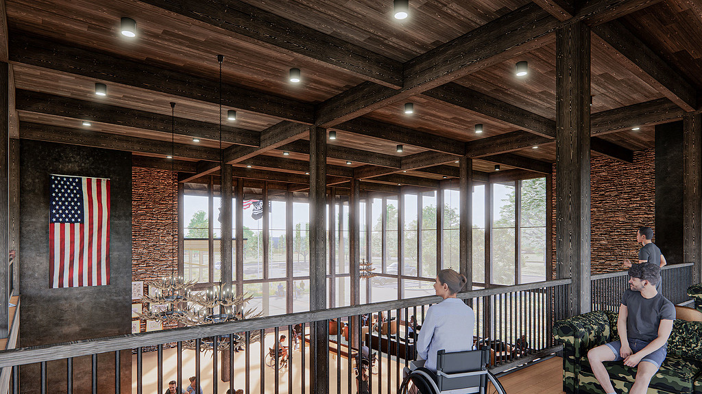 A group of people sitting on a balcony in a big open space with floor to ceiling windows
