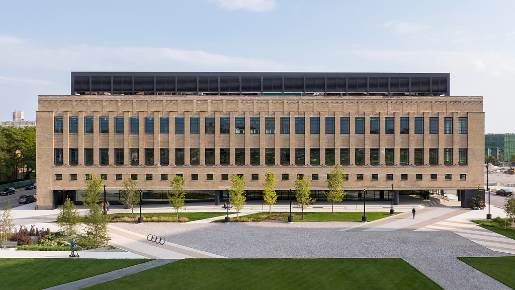 A straight on view of the book depository a large historic building made of masonry with many windows