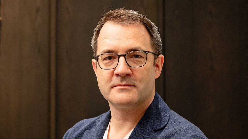 A man wearing glasses.