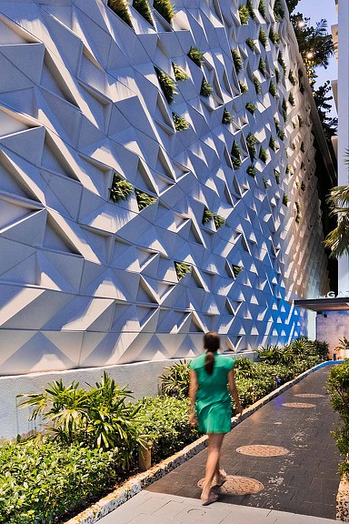 A person walking on a sidewalk.