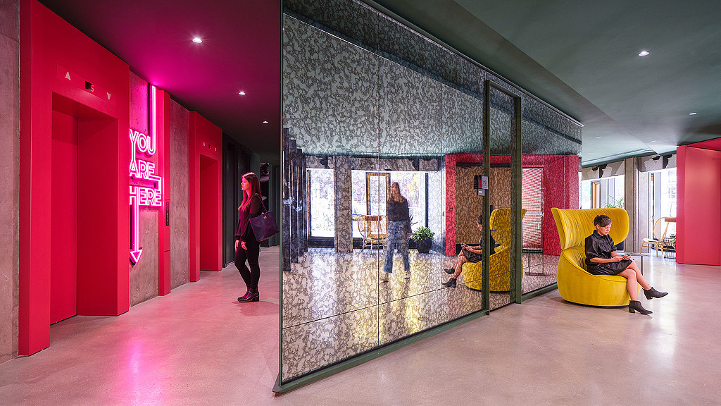 A person standing in a lobby.