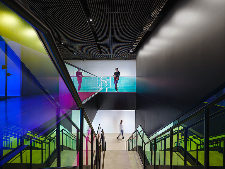 People walking down a flight of stairs.