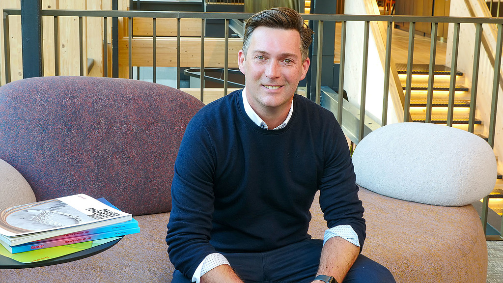 A man sitting on a couch.