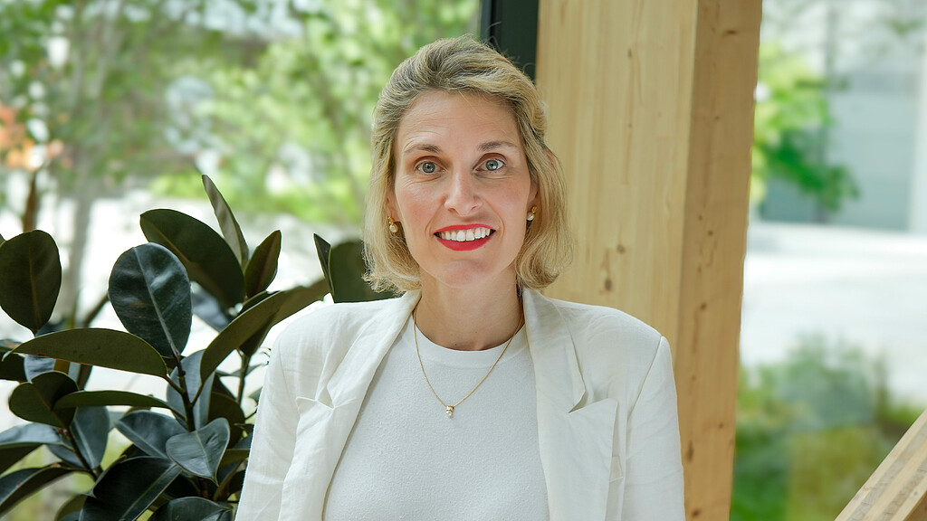 A woman smiling for the camera.