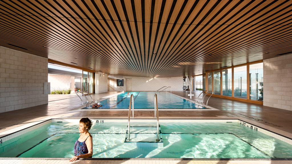 A person sitting in a swimming pool.