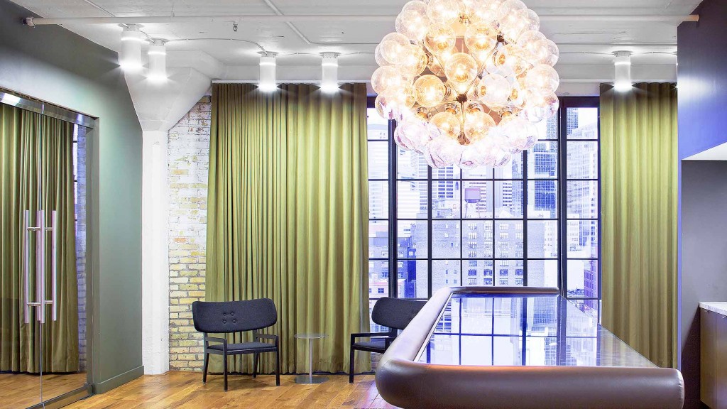 A room with a table and chairs.